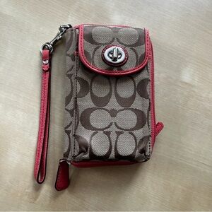 Coach Wristlet wallet in brown signature with coral/orange trim